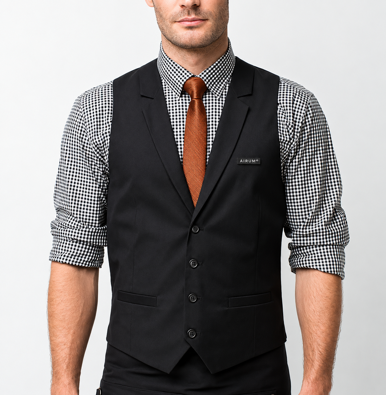 AIRUM hospitality staff uniform with black vest and branded name badge by Indy Blue Studio